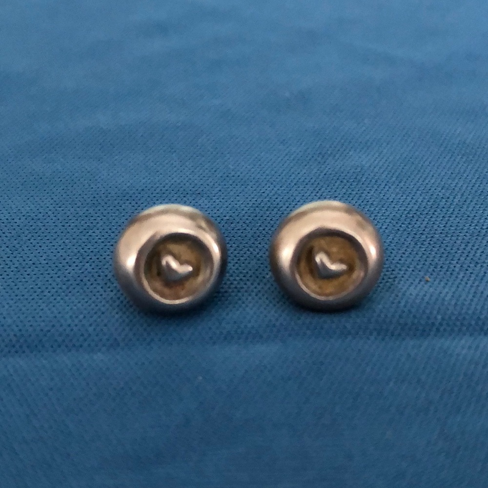 Silver button earrings with inlaid heart detail